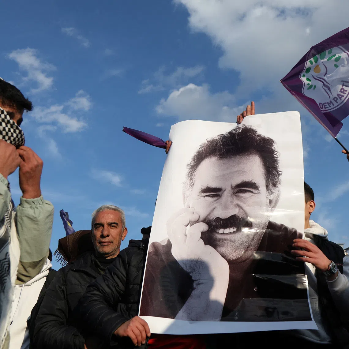 FILE PHOTO: A demonstrator holds a picture of jailed Kurdish militant leader Abdullah Ocalan during a rally in Diyarbakir, Turkey, February 27, 2025. REUTERS/Sertac Kayar/File Photo