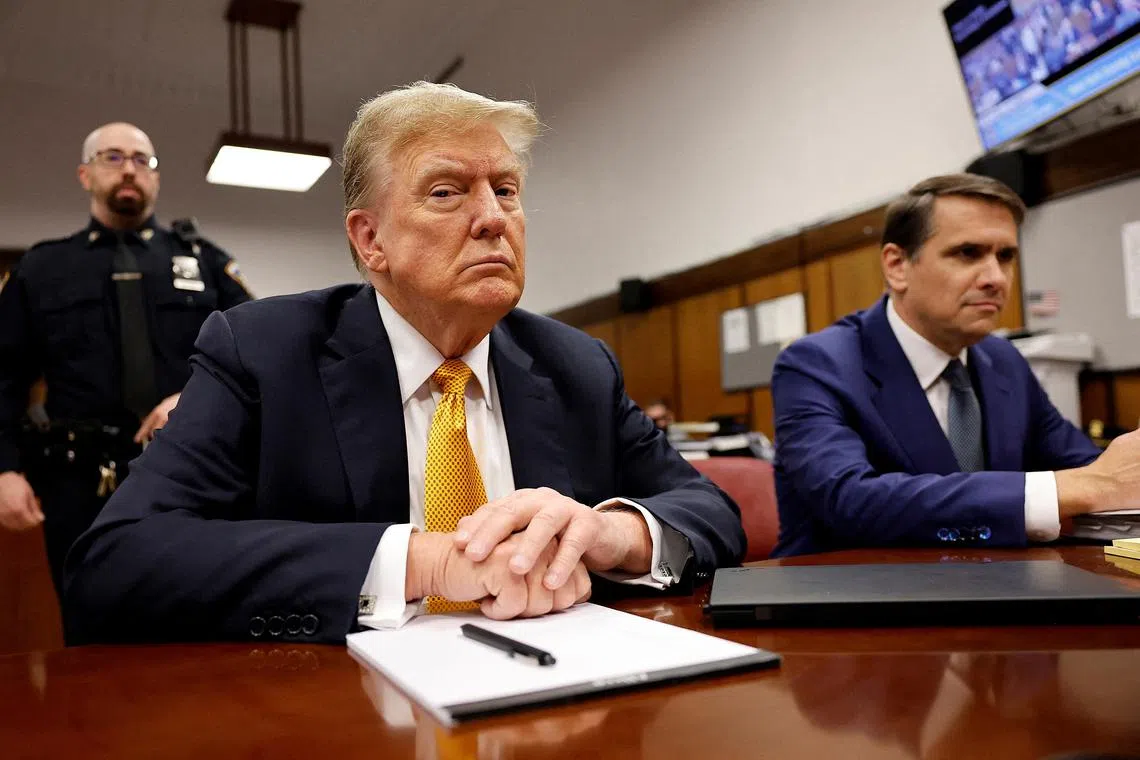 Former U.S. President Donald Trump sits in the courtroom at Manhattan Criminal Court with attorney Todd Blanche on May 21, 2024 in New York City. Michael M. Santiago/Pool via REUTERS