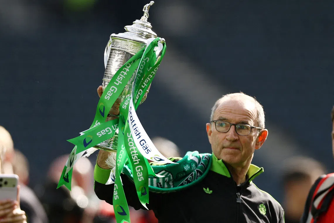 FILE PHOTO: Soccer Football - Scottish Cup - Final - Celtic v Dunfermline Athletic - Hampden Park, Glasgow, Scotland, Britain - May 23, 2026 Celtic manager Martin O'Neill celebrates with the trophy after winning the Scottish Cup Action Images via Reuters/Lee Smith/File Photo