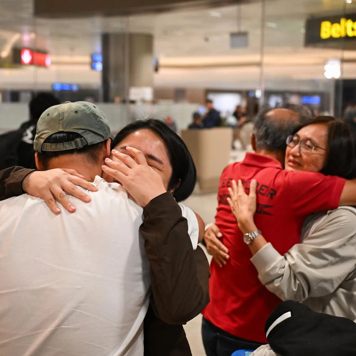 Ms Amanda Er, 31, a healthcare worker, tearing up as she is greeted by a loved one, after arriving at Changi Airport on a Republic of Singapore Air Force A330 multi-role tanker transport aircraft repatriation flight on March 11.