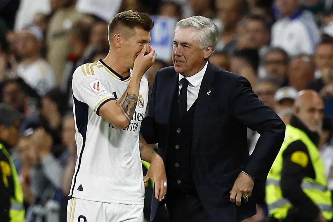 Real Madrid's Toni Kroos with coach Carlo Ancelotti after being substituted in the 5-0 Spanish La Liga win over Alaves.