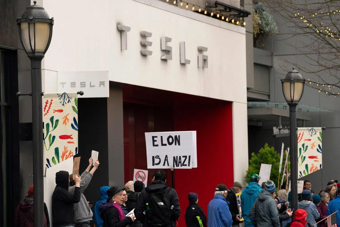 Protests were held over the weekend at dozens of Tesla's stores across the US, as consumers turn away from the brand due to a string of politicking by chief executive Elon Musk.