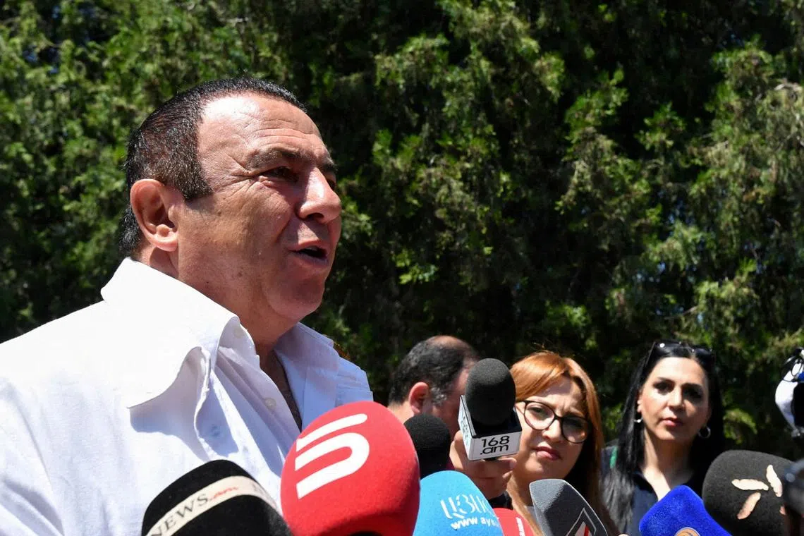 FILE PHOTO: Leader of the Prosperous Armenia party Gagik Tsarukyan speaks with journalists near a polling station during a parliamentary election in the village of Arinj outside Yerevan, Armenia, June 7, 2026. Stringer/Photolure via REUTERS/File Photo