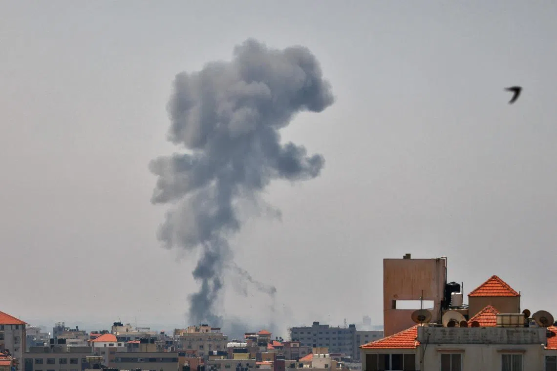 Smoke billows following Israeli military strikes on Islamic Jihad targets in Gaza City on May 10, 2023. 