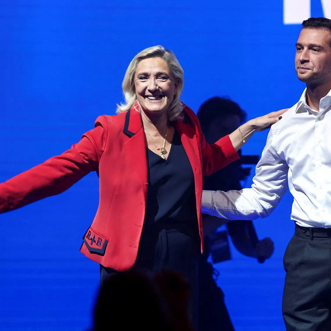 FILE PHOTO: FILE PHOTO: Marine Le Pen, French member of parliament and parliamentary leader of the far-right National Rally (Rassemblement National - RN) party and Jordan Bardella, president of the French far-right National Rally (Rassemblement National - RN) party and member of the European Parliament, attend an RN political rally in Bordeaux, France, September 14, 2025. REUTERS/Stephane Mahe/File Photo