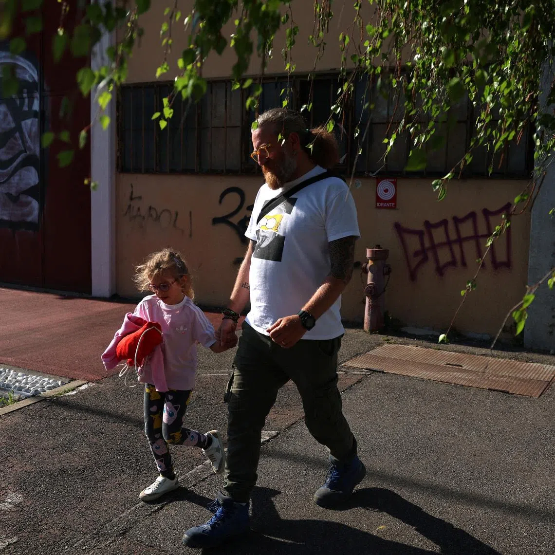 Father of two and family influencer Diego Di Franco takes his daughter Eva to a birthday party, in Trezzano sul Naviglio, Italy, April 9, 2026. REUTERS/Claudia Greco