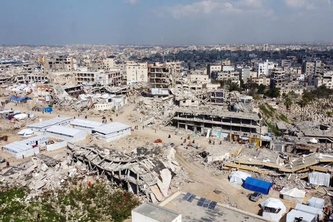 FILE PHOTO: A drone view shows displaced Palestinians sheltering in tents set up near the rubble of buildings destroyed during the Israeli offensive, amid a ceasefire between Israel and Hamas, in Gaza City February 17, 2025. REUTERS/Dawoud Abu Alkas/File Photo