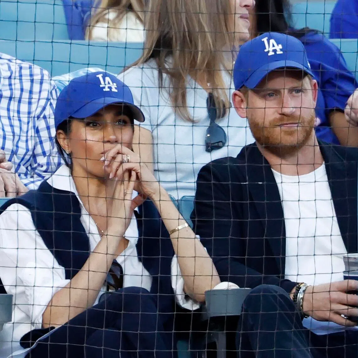Prince Harry, Duke of Sussex and Meghan, Duchess of Sussex look on from the stands during Game 4 of the 2025 World Series between the Toronto Blue Jays and the Los Angeles Dodgers at Dodger Stadium on Oct 28. 