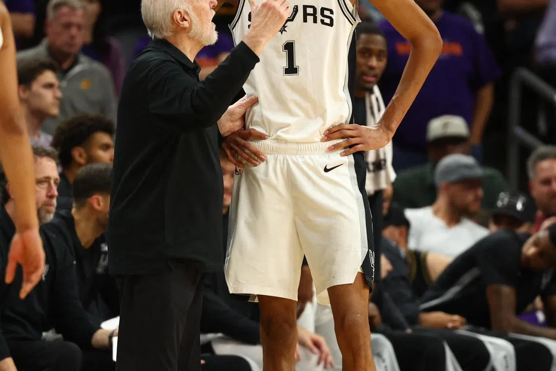 San Antonio Spurs centre Victor Wembanyama talking to coach Gregg Popovich during their win over the Phoenix Suns on Thursday. Popovich is a fan of the National Basketball Association In-Season Tournament, which begins on Friday.
