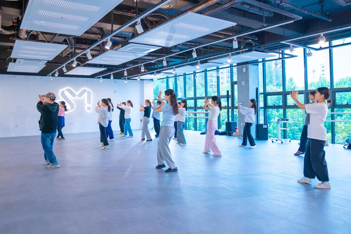 Students taking a dance lesson at the Seoul campus of SM Universe. A Singapore campus will open at *Scape come June 2025.