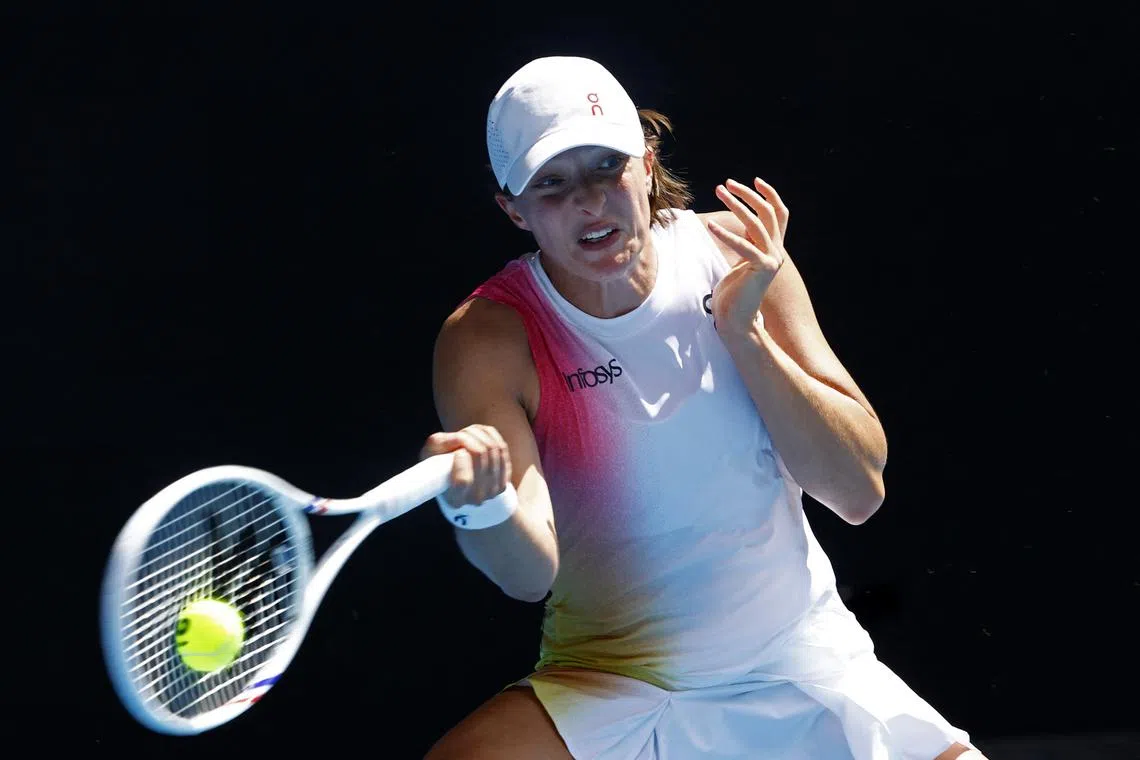Tennis - Australian Open - Melbourne Park, Melbourne, Australia - January 13, 2025 Poland's Iga Swiatek in action during her first round match against Czech Republic's Katerina Siniakova REUTERS/Kim Kyung-Hoon