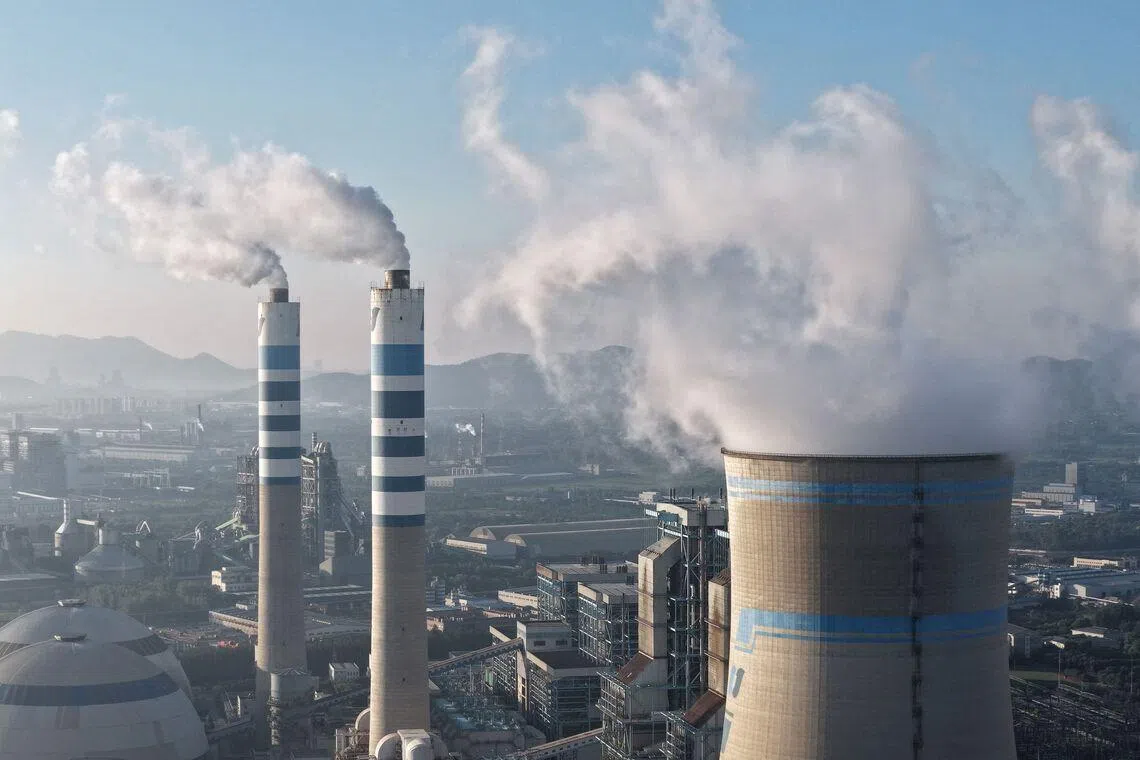 TOPSHOT - A coal-fired power plant is seen in Zhenjiang, in China’s eastern Jiangsu province on July 15, 2026. (Photo by CN-STR / AFP) / China OUT