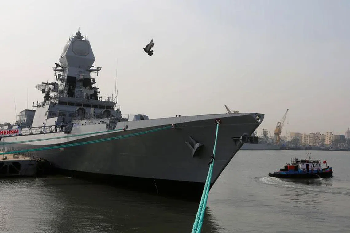 FILE PHOTO: A bird flies past the newly built INS Chennai, India’s third indigenously designed guided missile destroyer, ahead of its commissioning into the Navy in Mumbai, India November 18, 2016. REUTERS/Shailesh Andrade