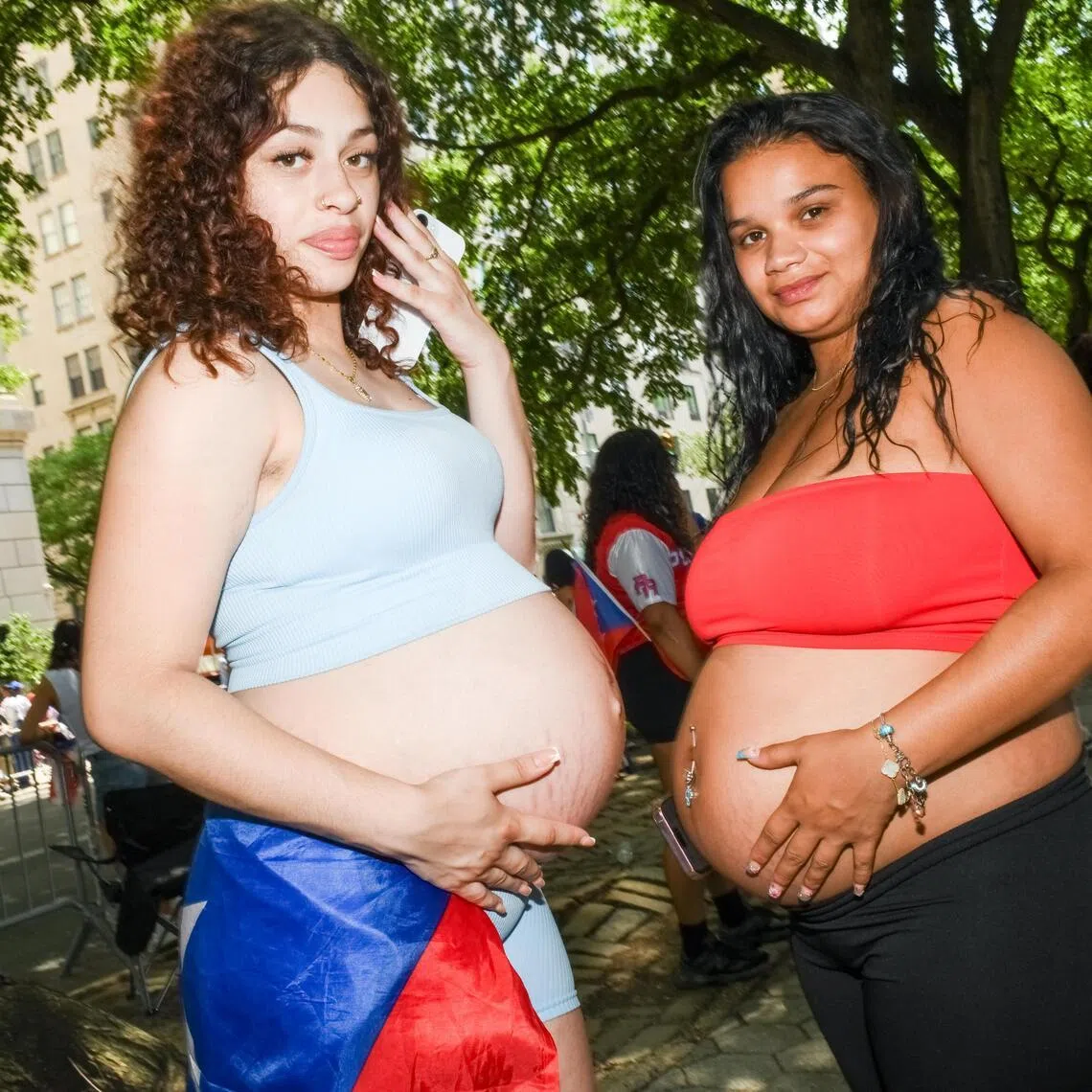 Ereshka Garcia, and Aricelis Medina at the Puerto Rican Day Parade in New York. Pregnant women going the Rihanna route: reveal, style and exalt a new, if temporary, silhouette.