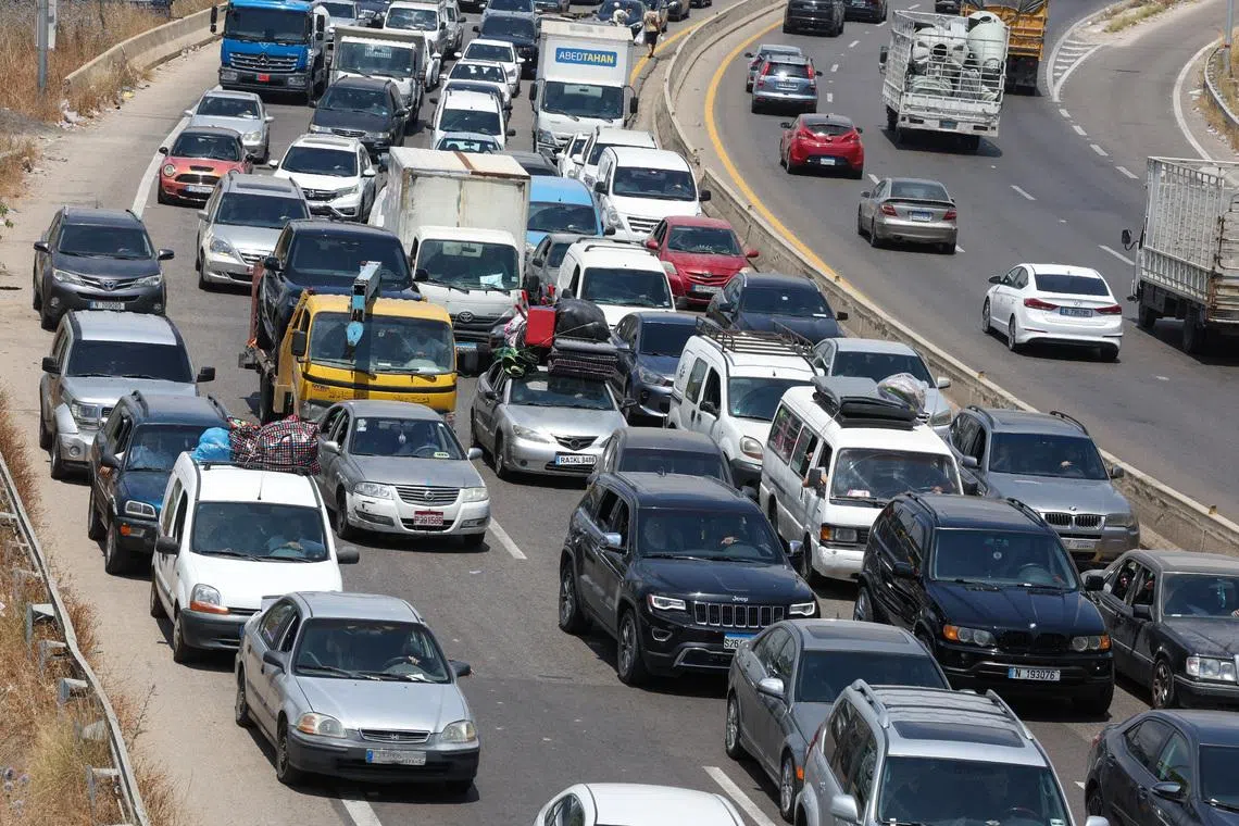 Hundreds of thousands of Lebanese head home as fighting eases, many still stranded
