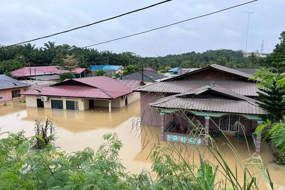 YONG PENG - Flooded homes in Yong Peng town, northwest Johor, on Saturday. 
