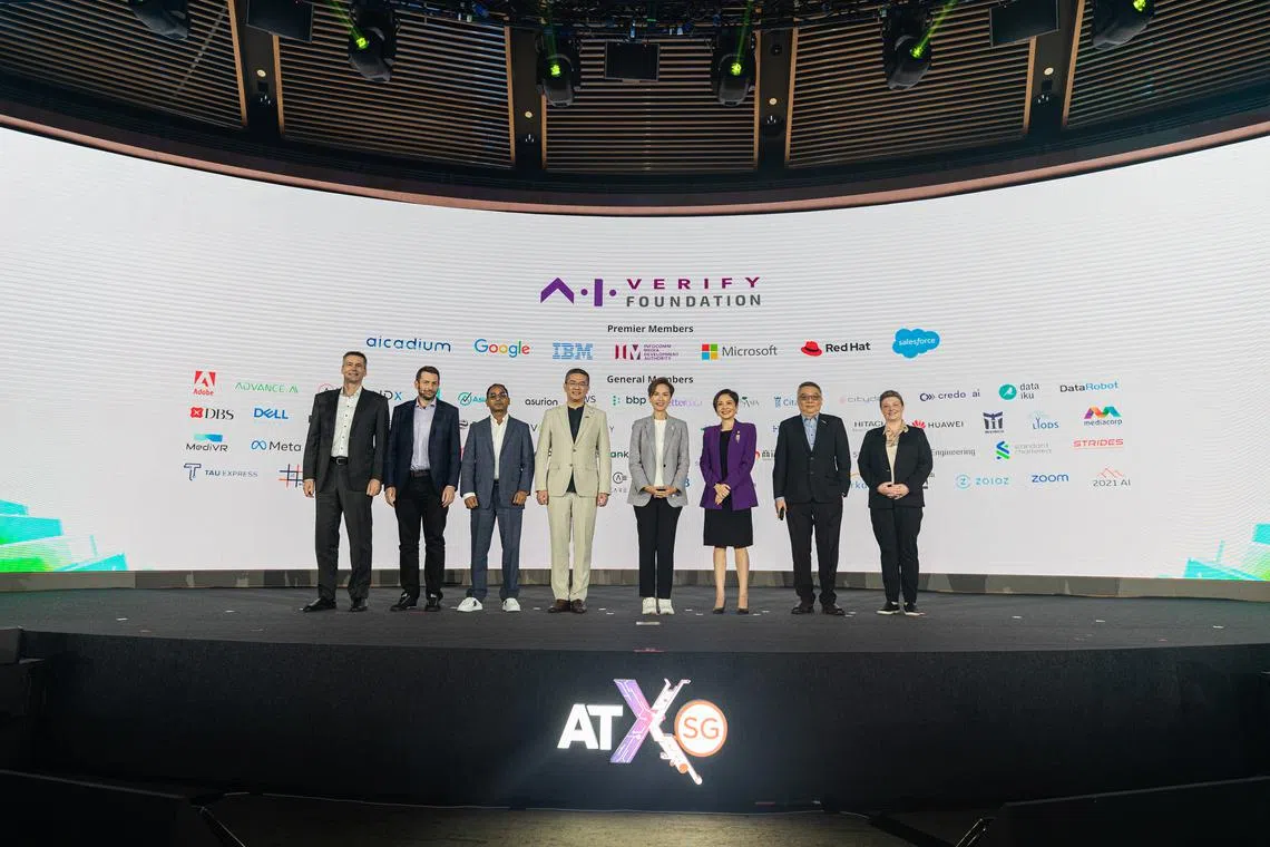 Minister for Communications and Information (centre) with members of the AI Verify Foundation, comprising members of the AI scene including IBM and Google. 