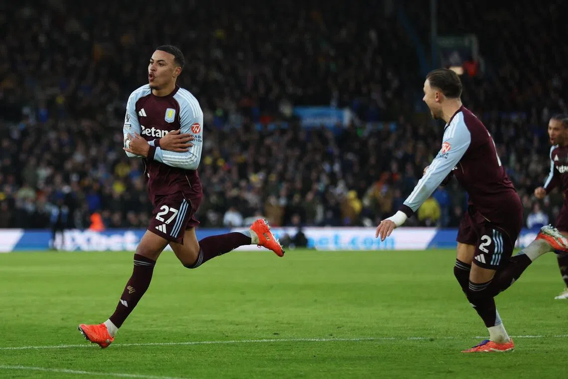 Aston Villa's Morgan Rogers (left) celebrates scoring his second goal with Matty Cash in the 2-1 English Premier League win over Leeds United at Elland Road on Nov 23, 2025.
