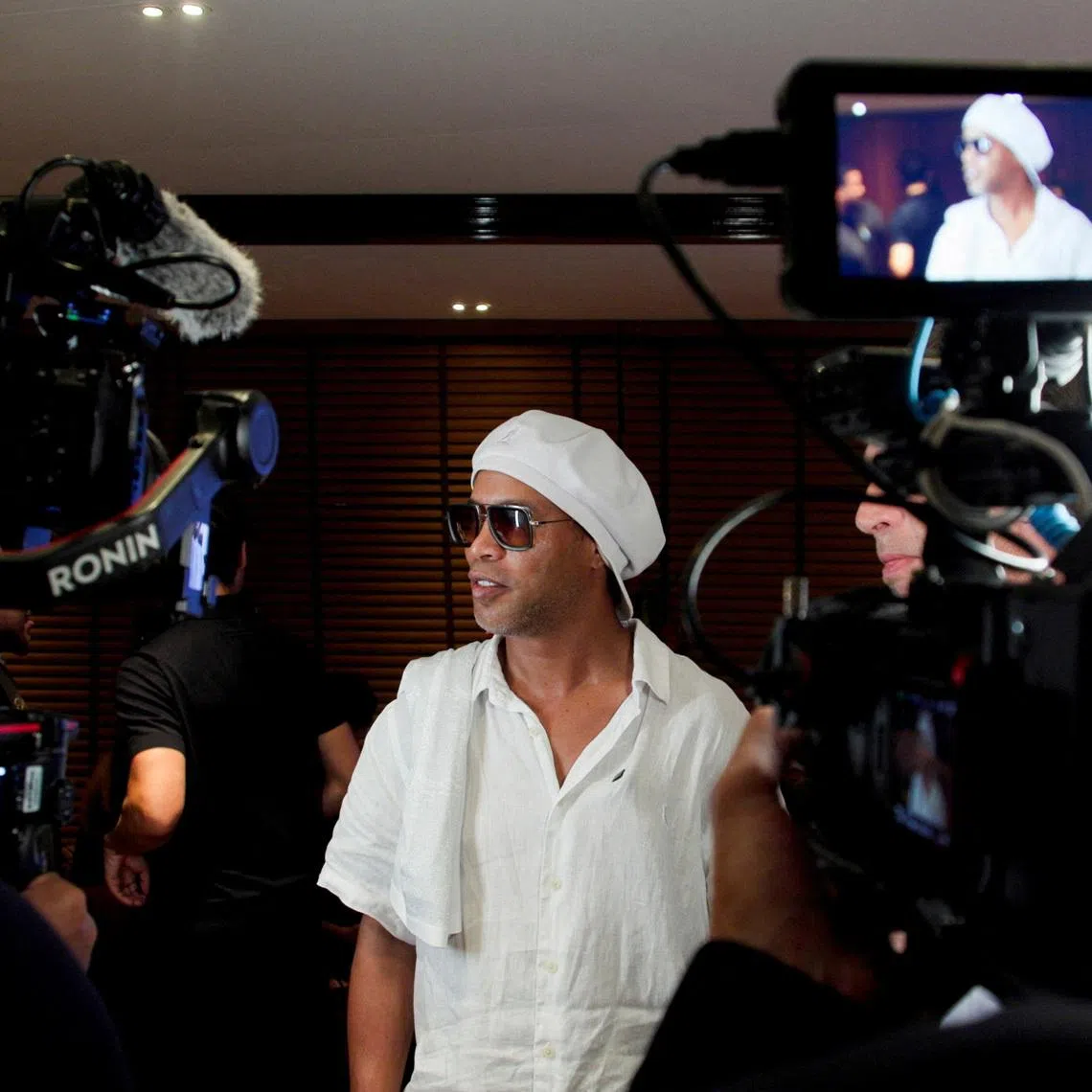Former Brazil soccer player Ronaldinho speaks in front of cameras after the announcement of his signing with the Italian club Ravenna FC, in Miami, Florida, U.S., June 23, 2026. REUTERS/Maria Alejandra Cardona