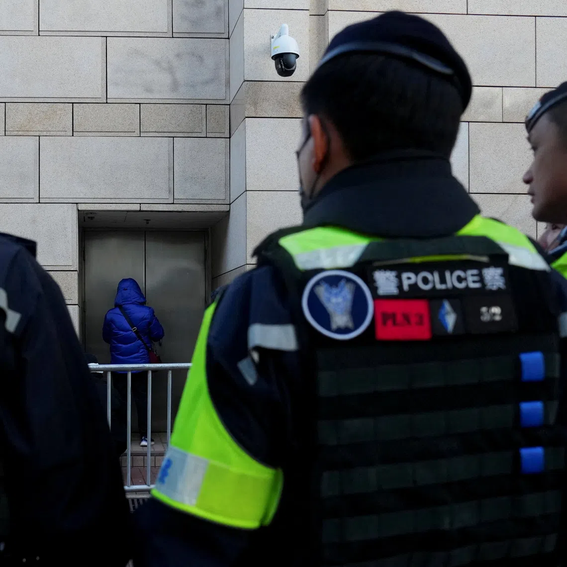 People queue outside the West Kowloon Magistrates' Courts building for the verdict in the national security collusion trial of Jimmy Lai, founder of the now-defunct pro-democracy newspaper Apple Daily, in Hong Kong, China, December 15, 2025. REUTERS/Lam Yik