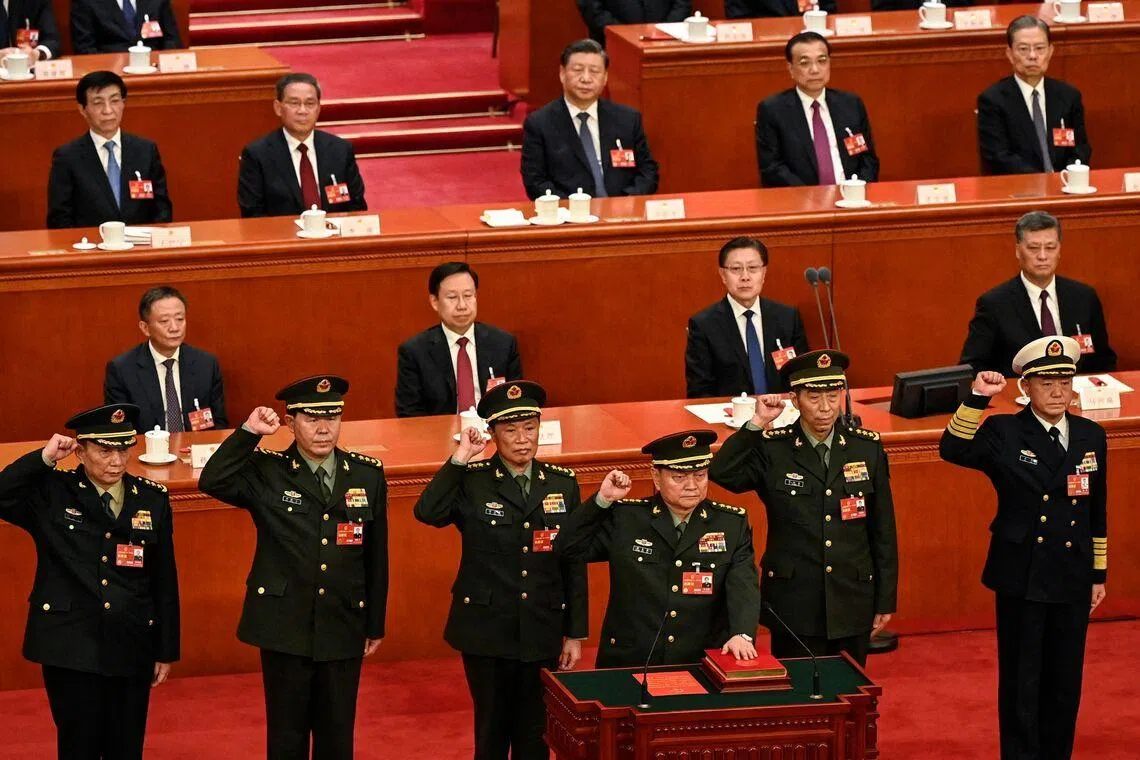 China’s top generals Zhang Youxia (foreground) and Liu Zhenli (standing, second from left) were ousted on Jan 24.