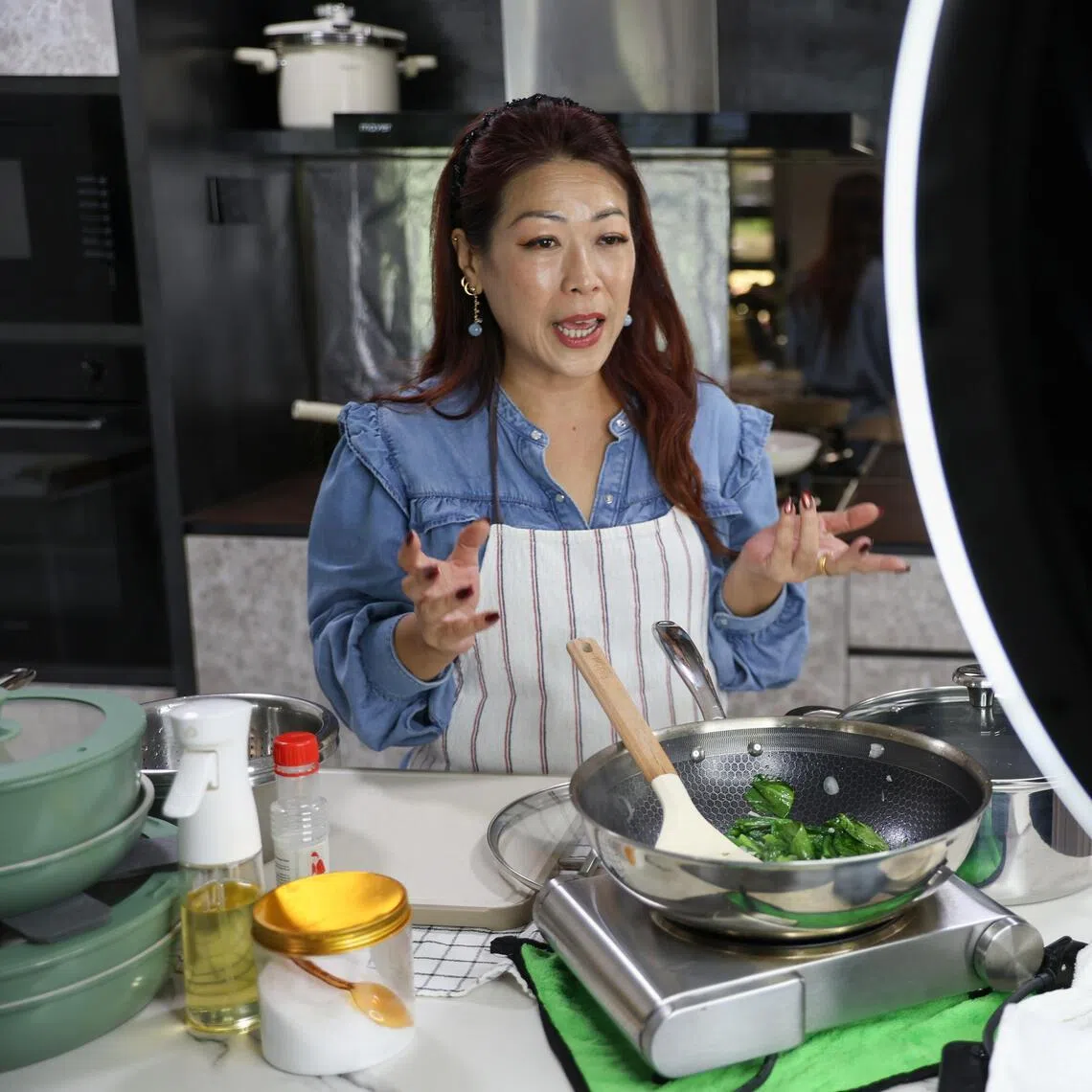 Ms Joyce Mak, a mother who does live streams promoting cooking and skincare products from home, with her streaming set-up at home on May 12. 