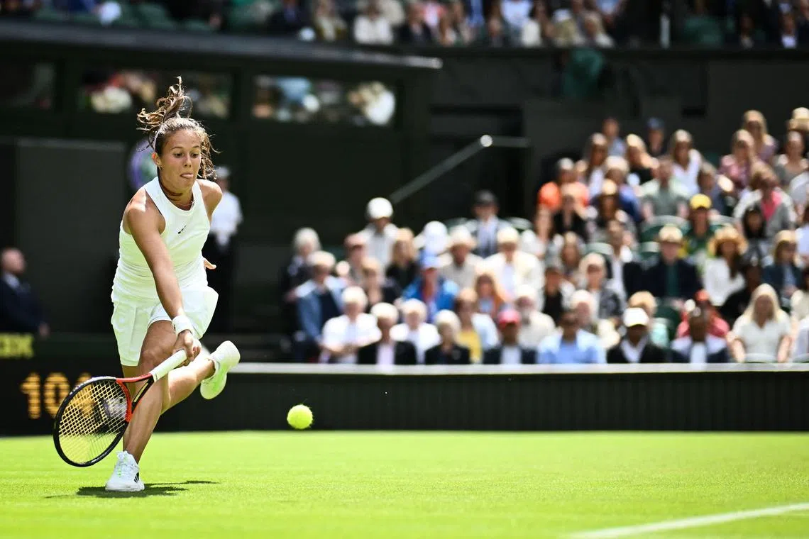 Daria Kasatkina returns the ball to Britain's Jodie Burrage.