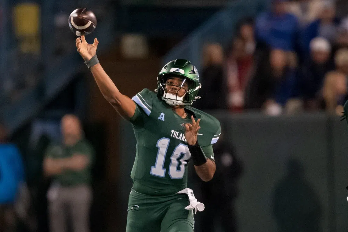 Nov 28, 2024; New Orleans, Louisiana, USA;  Tulane Green Wave quarterback Darian Mensah (10) throws against the Memphis Tigers during the first quarter at Yulman Stadium. Mandatory Credit: Matthew Hinton-Imagn Images/ File Photo