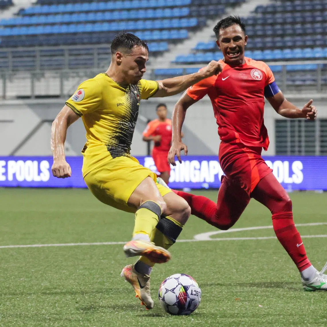 Brunei DPMM's Miguel Oliveira (left) in action during the Singapore Cup match against Young Lions Ryaan Sanizal at Jalan Besar Stadium on Feb 15.
