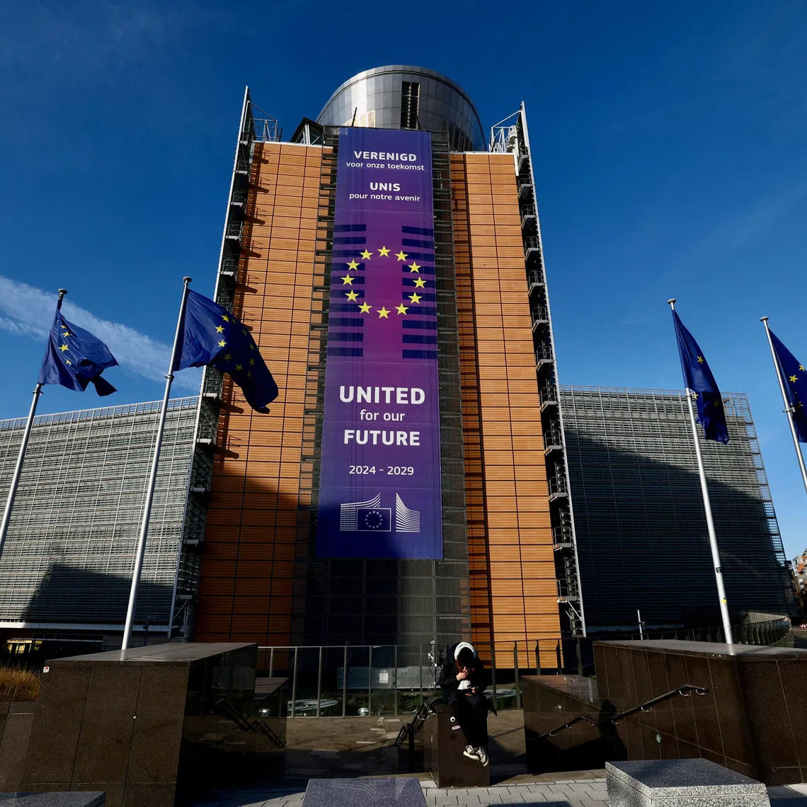 European Union flags flutter outside the European Commission headquarters in Brussels, Belgium December 15, 2025. REUTERS/Yves Herman