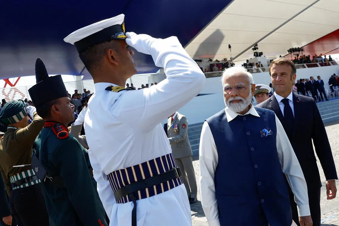 India's PM Modi and French President Emmanuel Macron attend the annual Bastille Day military parade, in Paris on July 14.
