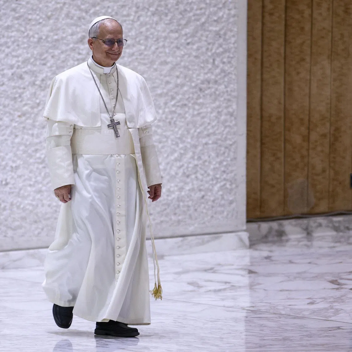 FILE PHOTO: Pope Leo XIV arrives to hold an audience with representatives of the media in Paul VI hall at the Vatican, May 12, 2025. REUTERS/Guglielmo Mangiapane/File Photo