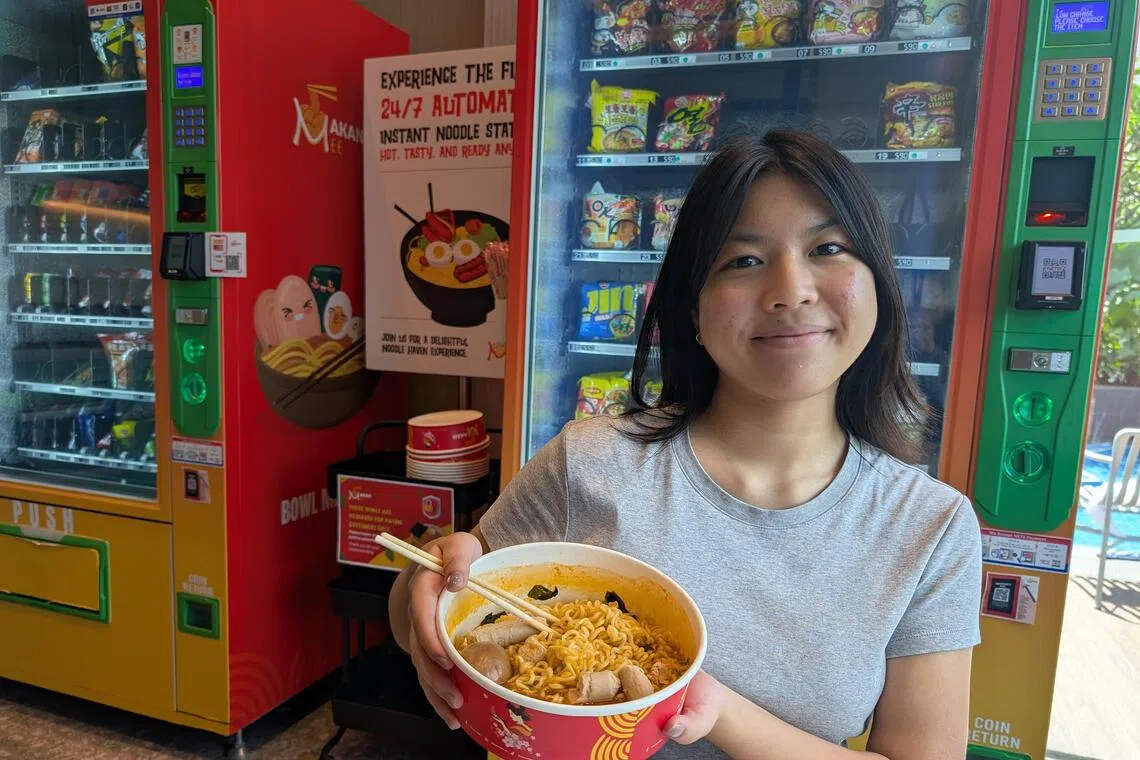 ayyramen -  Intern journalist Megan Ching with her noodles creation at Makan Mee: Shin Ramyun shrimp flavour with boiled egg and chicken sausage, coming up to a total of $10.30.

ST Photo: Ang Yiying