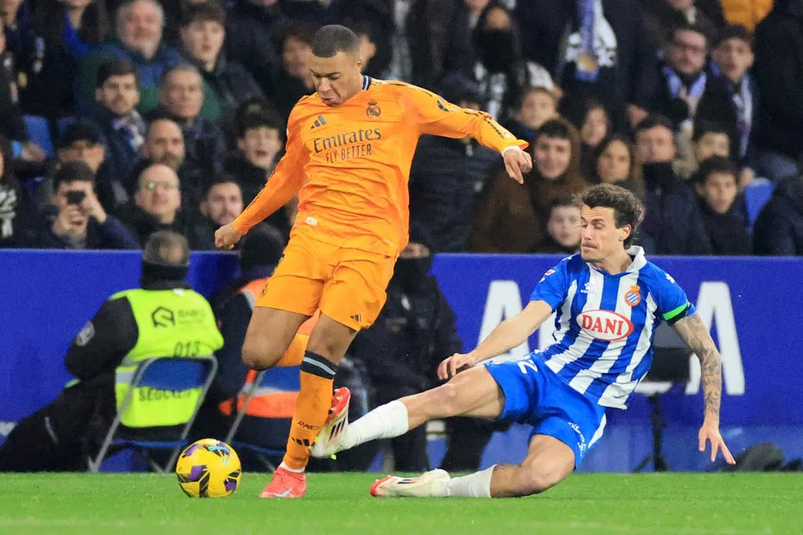 Real Madrid's Kylian Mbappe being fouled by Espanyol's Carlos Romero during their La Liga clash on Feb 1. Los Blancos were beaten 1-0.