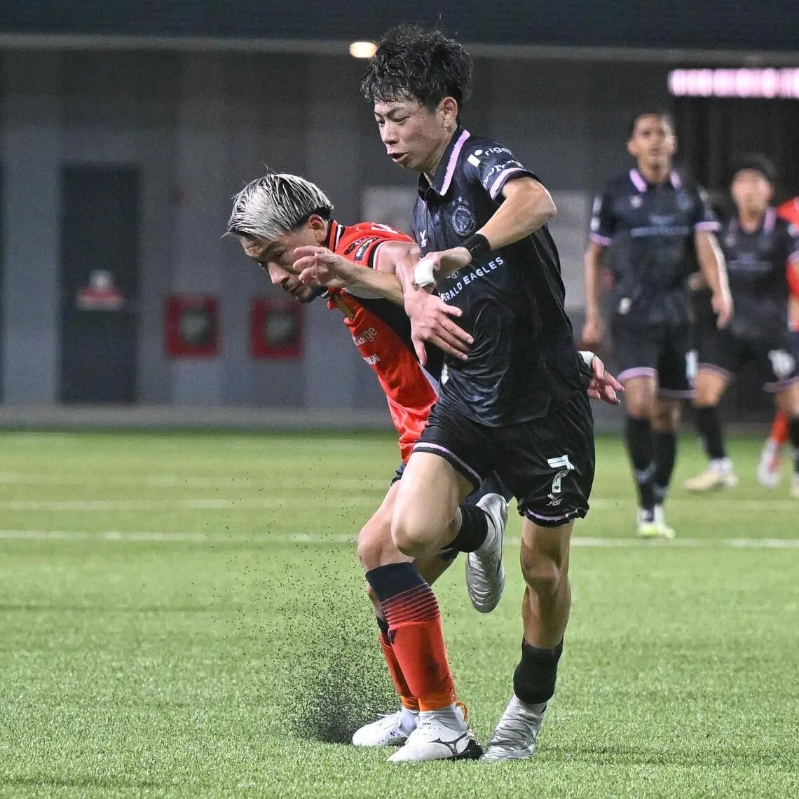 Geylang International's Riku Fukashiro (right) tussles with Hougang United's Yuta Kikuchi who was later sent off for a headbutt on Fukashiro.