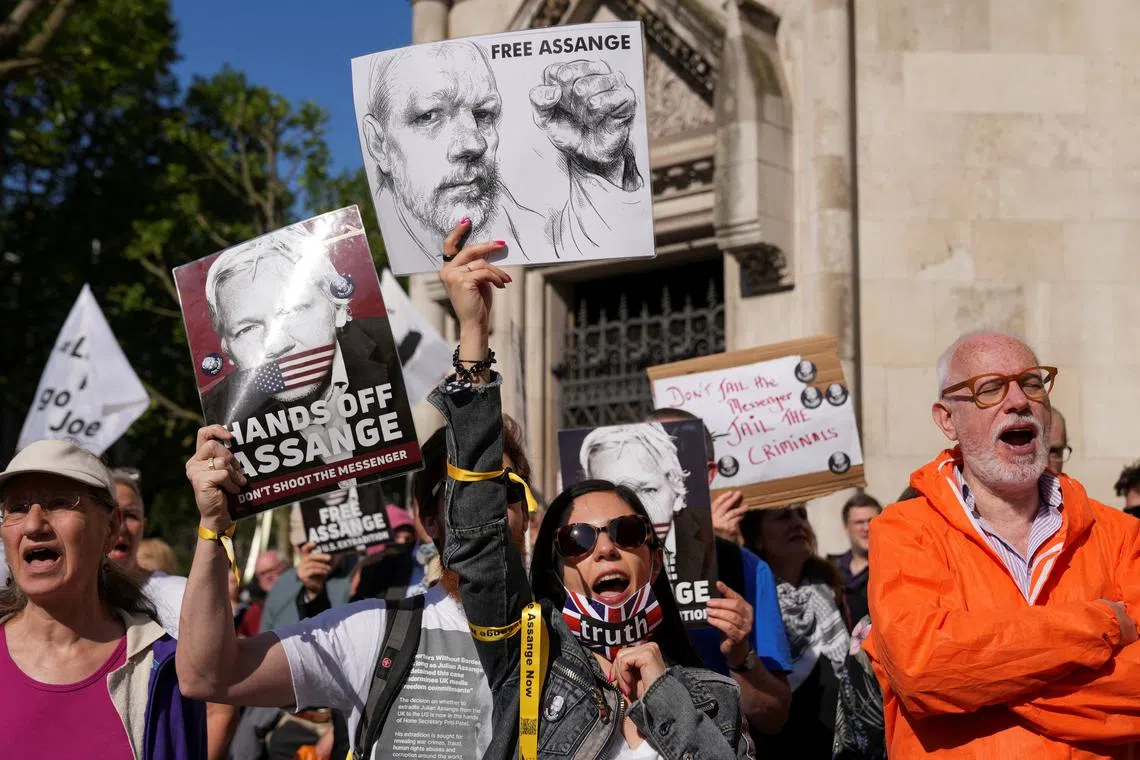People attend a protest outside the High Court on the day of an extradition hearing of WikiLeaks founder Julian Assange, in London, Britain, May 20, 2024. REUTERS/Maja Smiejkowska