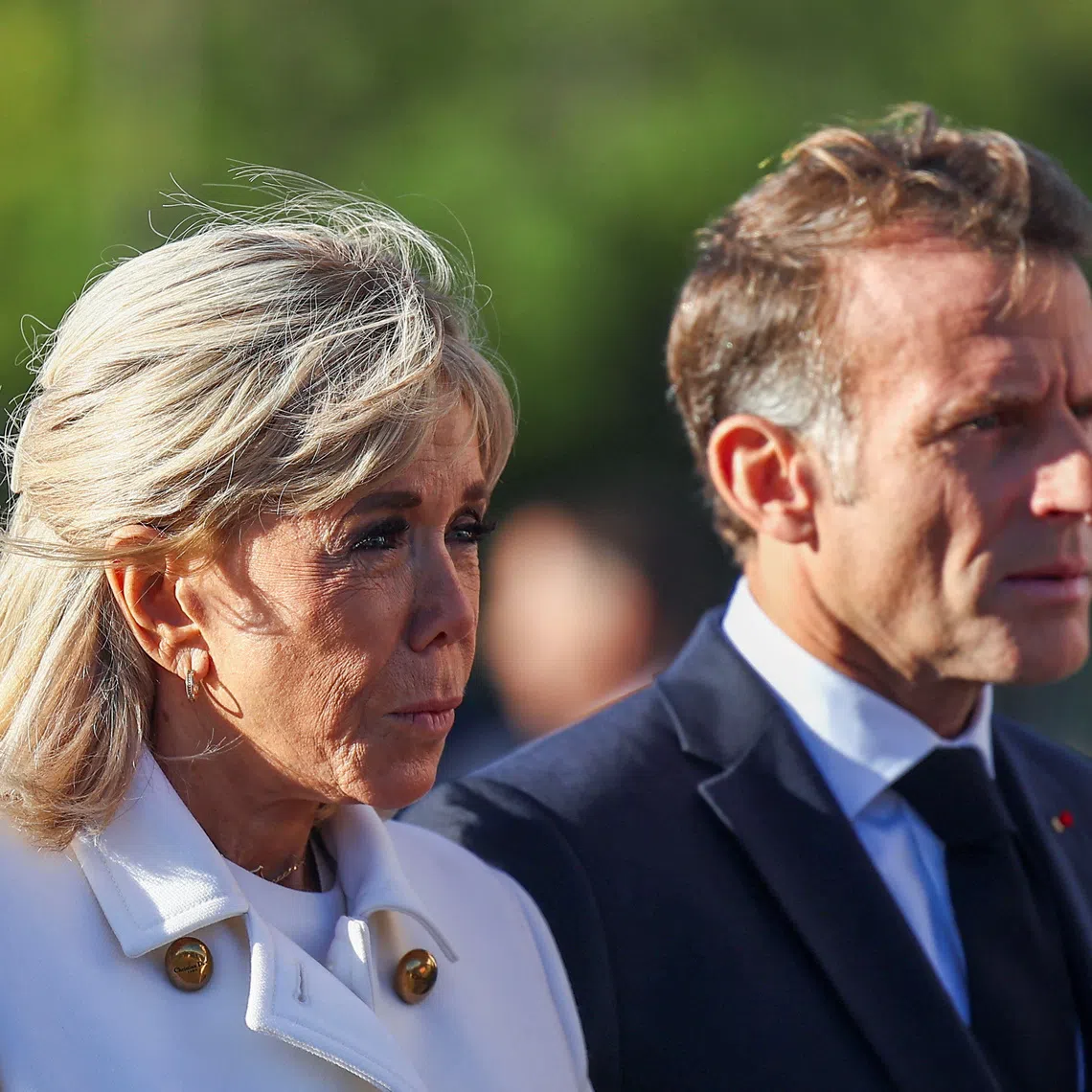 French President Emmanuel Macron and his wife Brigitte Macron attend a welcome ceremony for German President Frank-Walter Steinmeier and his wife Elke Buedenbender at the Arc de Triomphe in Paris as part of their state visit to France, October 8, 2026. REUTERS/Abdul Saboor/Pool