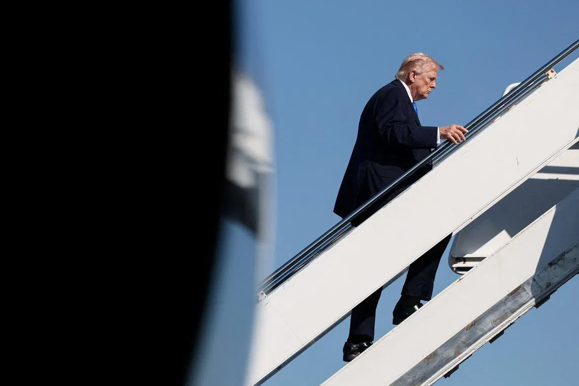 U.S. President Donald Trump boards Air Force One as he departs West Palm Beach, Florida, U.S., March 23, 2026. REUTERS/Kevin Lamarque