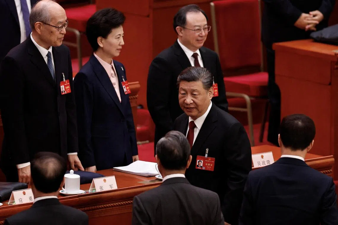 Chinese President Xi Jinping leaves at the end of the opening session of the National People's Congress (NPC) at the Great Hall of the People in Beijin, China March 5, 2024. REUTERS/Tingshu Wang