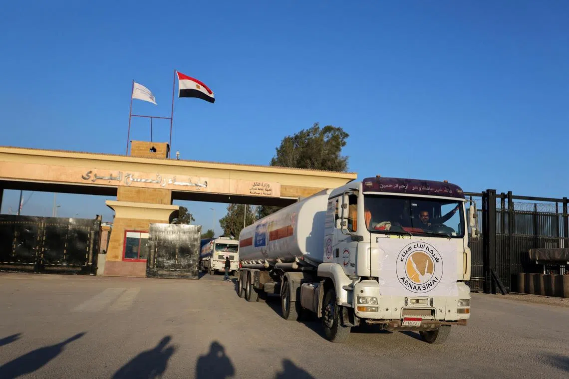 A truck marked with the UNRWA logo crosses into Egypt from Gaza during a temporary truce between Hamas and Israel on Nov 30, 2023. 
