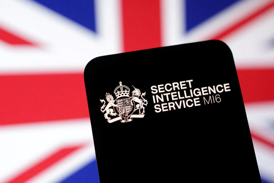 MI6 (Secret Intelligence Service) logo and UK flag are seen in this illustration taken May 6, 2025. REUTERS/Dado Ruvic/Illustration/File Photo