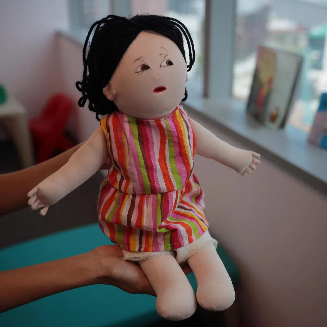 An anatomically-correct doll seen in a room where Police speak with victims of child sexual abuse cases on April 12, 2021. 