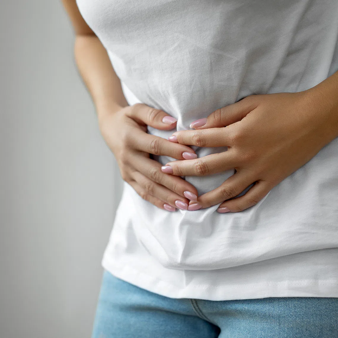 Post-infection irritable bowel syndrome causes recurrent abdominal pain or discomfort along with diarrhoea or constipation, or both, following an acute gut infection.