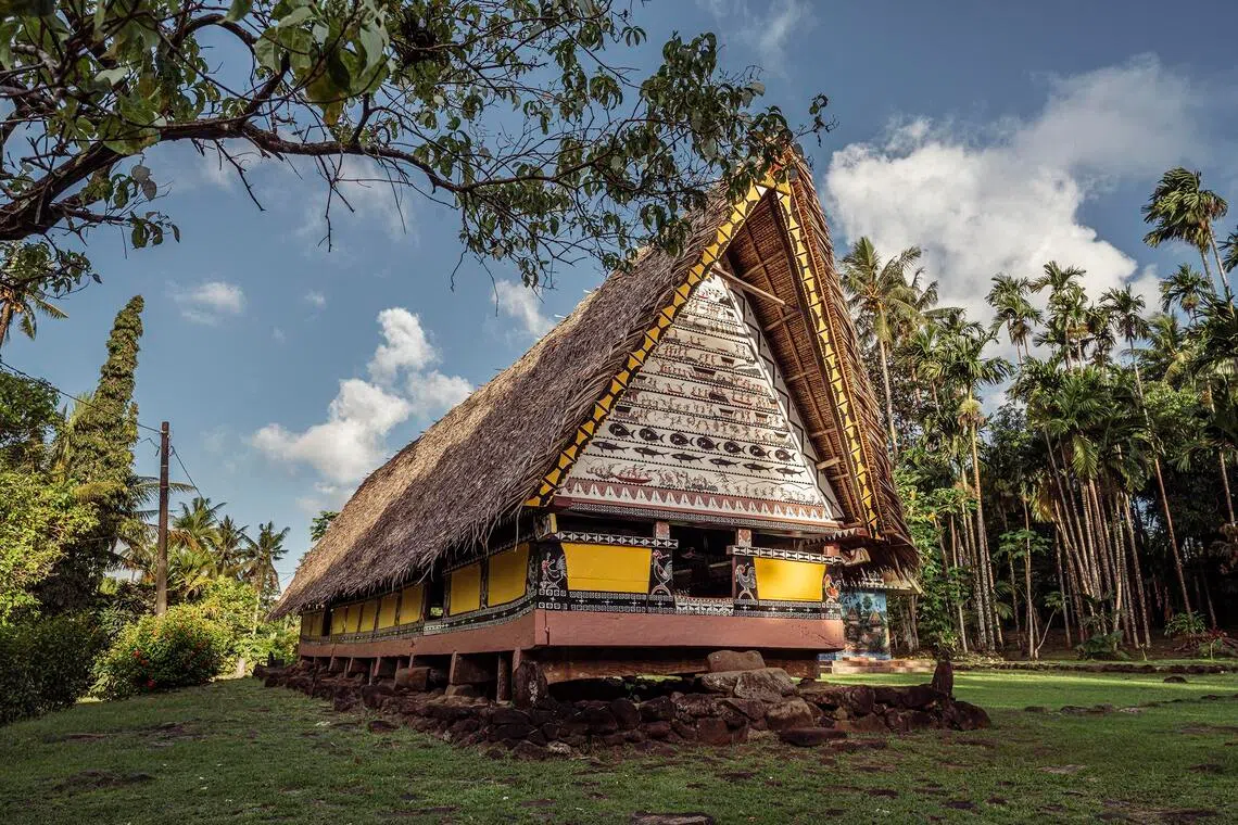 The Bai is a traditional Palauan community meeting house with an A-frame roof, where chiefs would historically gather.