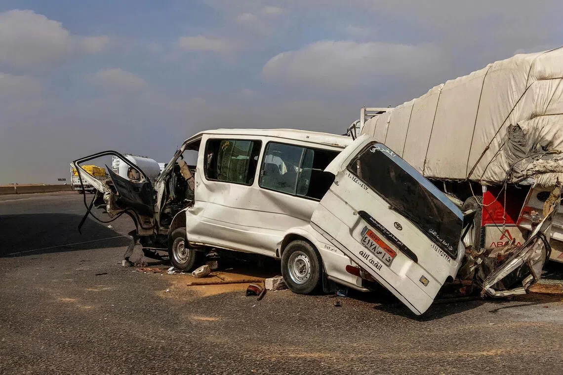 The wreckage of a minibus on a highway on the outskirts of Cairo on Oct 31, after it collided with a truck.
