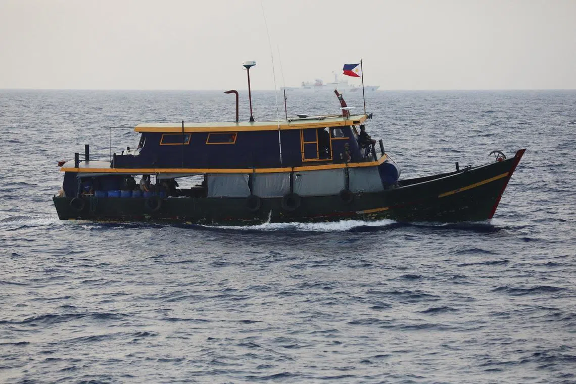 A Philippine supply boat sails during a resupply mission for Filipino troops stationed at a grounded warship in the South China Sea on Oct 4. 
