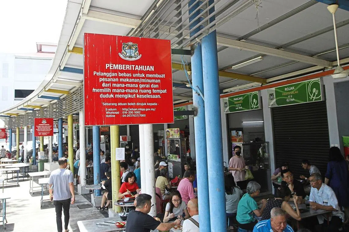 Bright red signages have now been placed at popular hawker centres to make it clear that “the customers are free to sit anywhere and order from any stall”.
