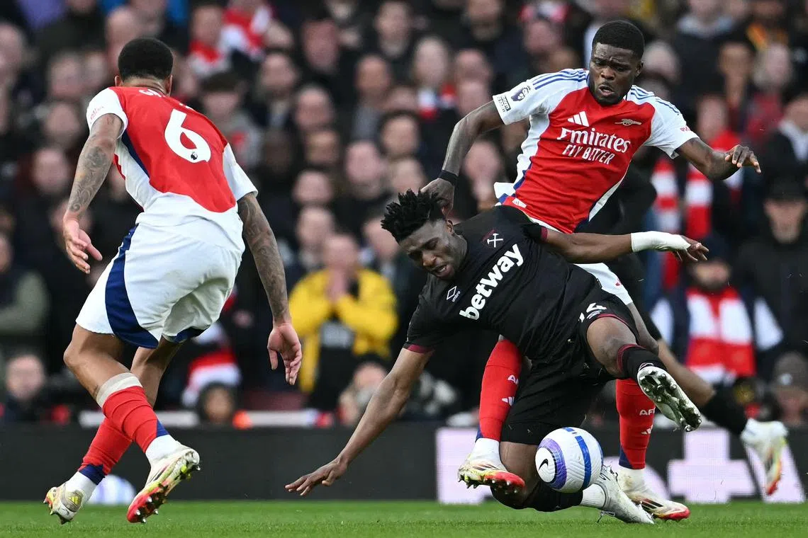 Arsenal's Thomas Partey fouling West Ham's Mohammed Kudus in their English Premier League football match at the Emirates Stadium on Feb 22, 2025. They accounted for all the goals in Ghana's 3-0 win over Madagascar in a World Cup qualifier. 
