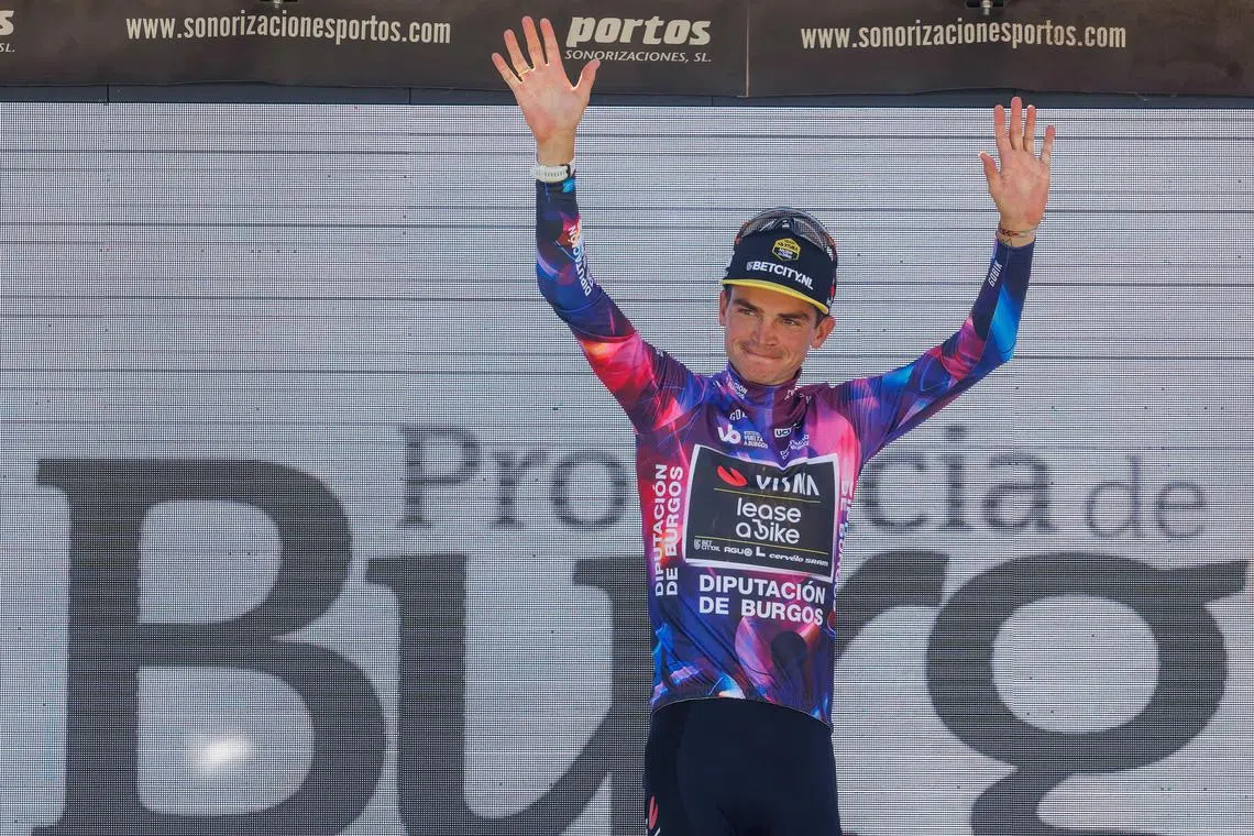 US rider Sepp Kuss of Visma-Lease a Bike team celebrates on the podium after winning the 46th Vuelta Ciclista a Burgos'  fifth and last stage on Aug 9, 2024.
