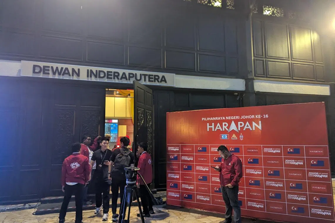 Pakatan Harapan officials gathering at the results viewing party in Pulai Springs Resorts in south-west Johor.